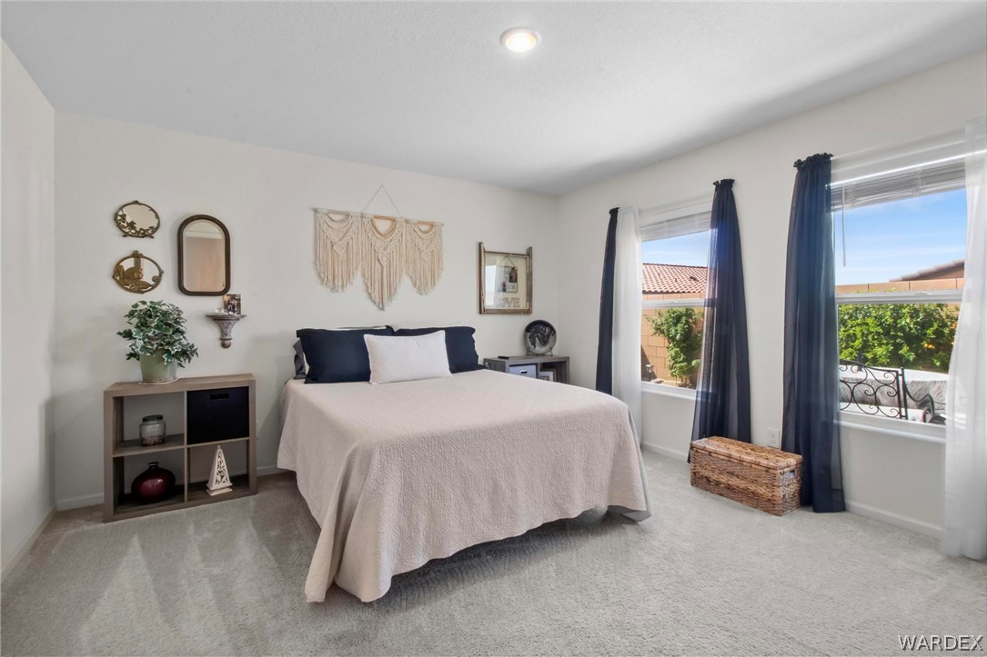 2424 Granite Road Bullhead City, AZ 86442 - Photo 20 of 50 Carpeted bedroom with recessed lighting and multiple windows