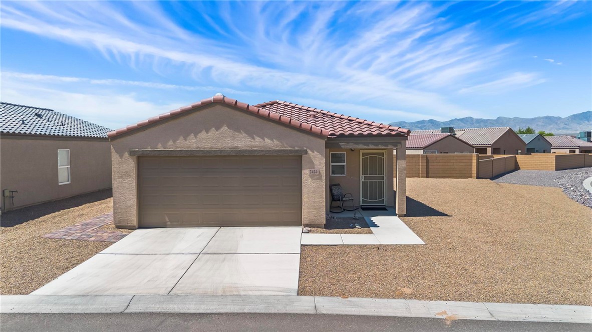 2424 Granite Road Bullhead City, AZ 86442 - Photo 35 of 50 Single-story residence featuring a tile roof and an attached garage