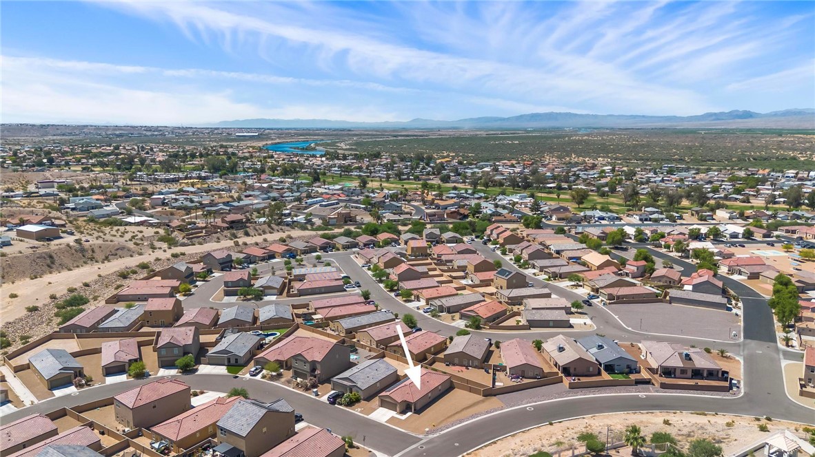 2424 Granite Road Bullhead City, AZ 86442 - Photo 38 of 50 Aerial view of a residential neighborhood with arid landscaping