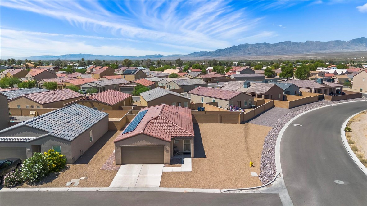 2424 Granite Road Bullhead City, AZ 86442 - Photo 40 of 50 Aerial perspective showcasing a residential neighborhood with mountain backdrop