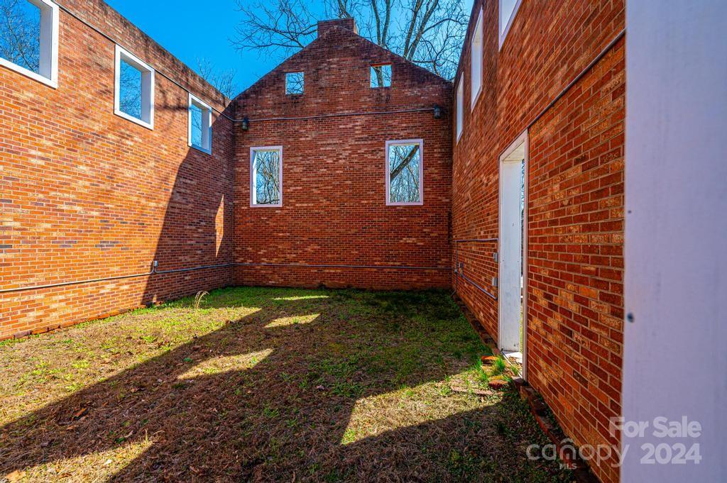 3878 Robinson Road Newton, NC 28658 - Photo 12 of 47 a view of a brick house with a yard