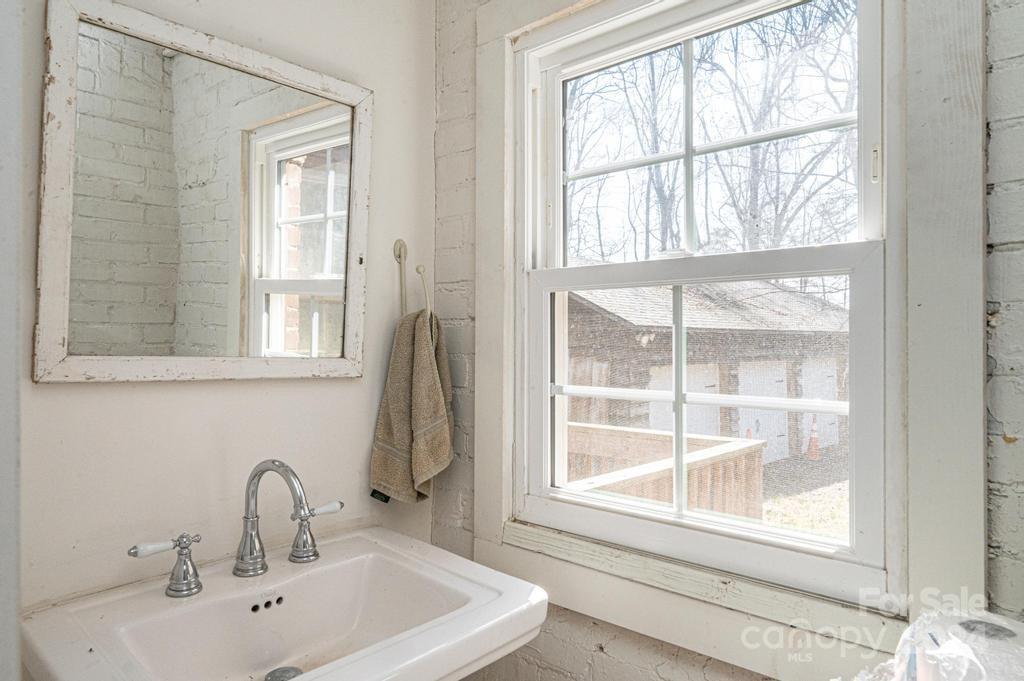 3878 Robinson Road Newton, NC 28658 - Photo 17 of 47 a bathroom with a sink and a window
