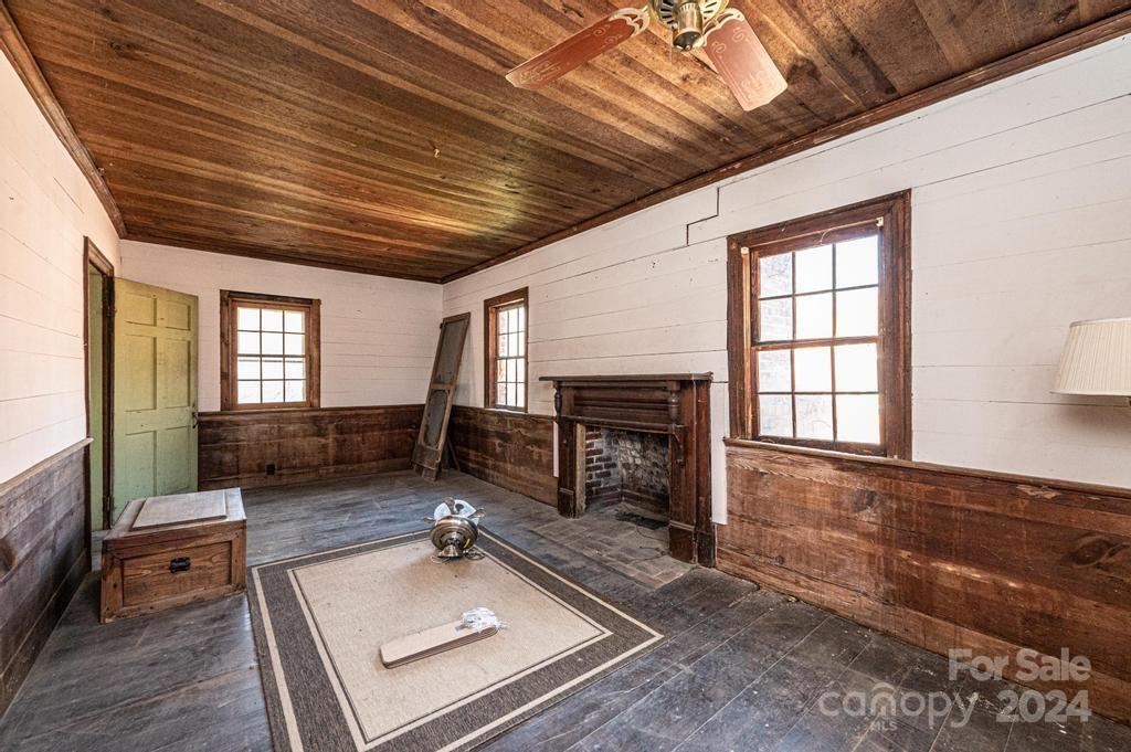 3878 Robinson Road Newton, NC 28658 - Photo 26 of 47 a living room with furniture and a fireplace