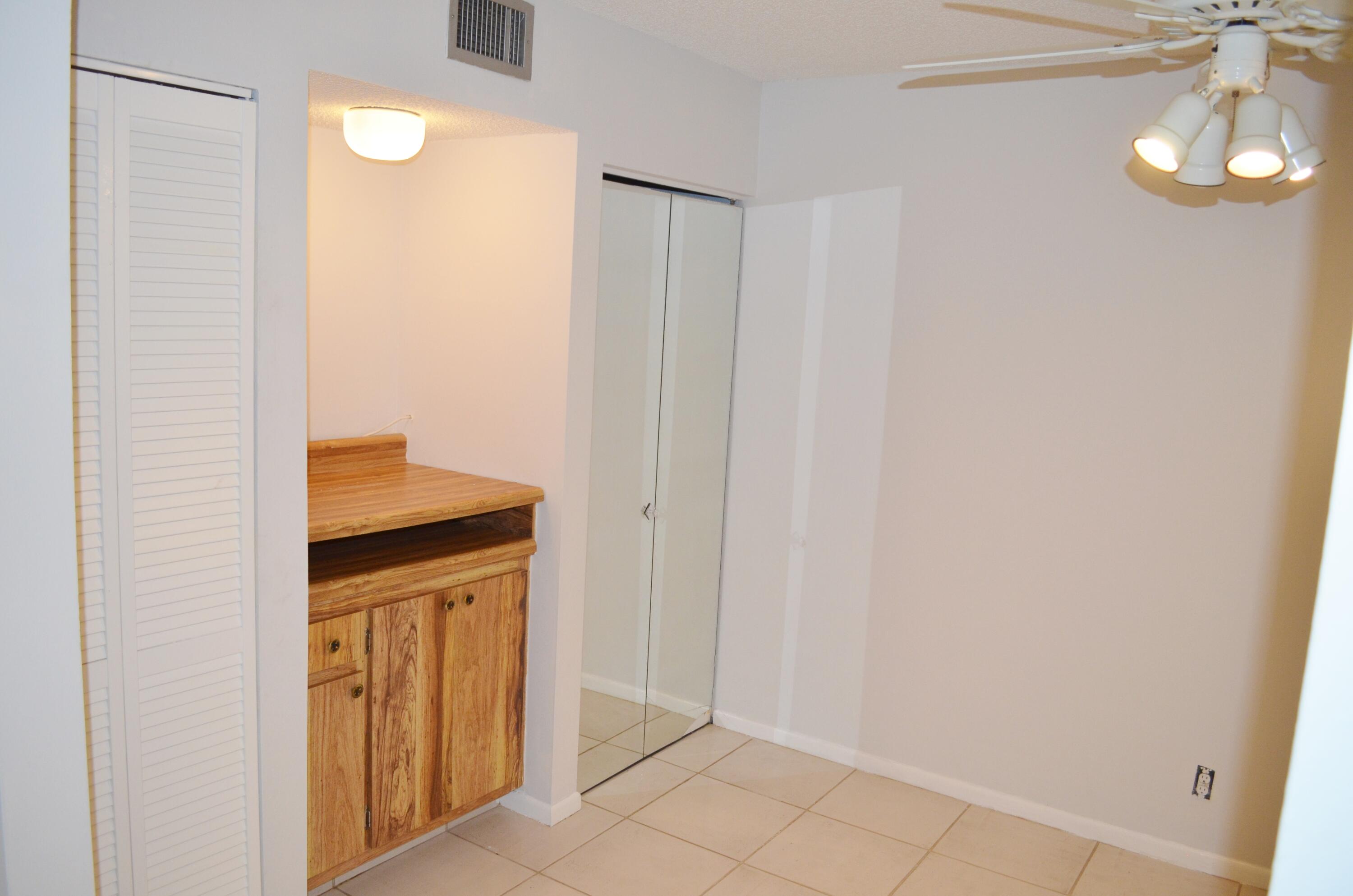 5220 Las Verdes Circle, Unit 211 Delray Beach, FL 33484 - Photo 11 of 57 a bathroom with a sink and a mirror
