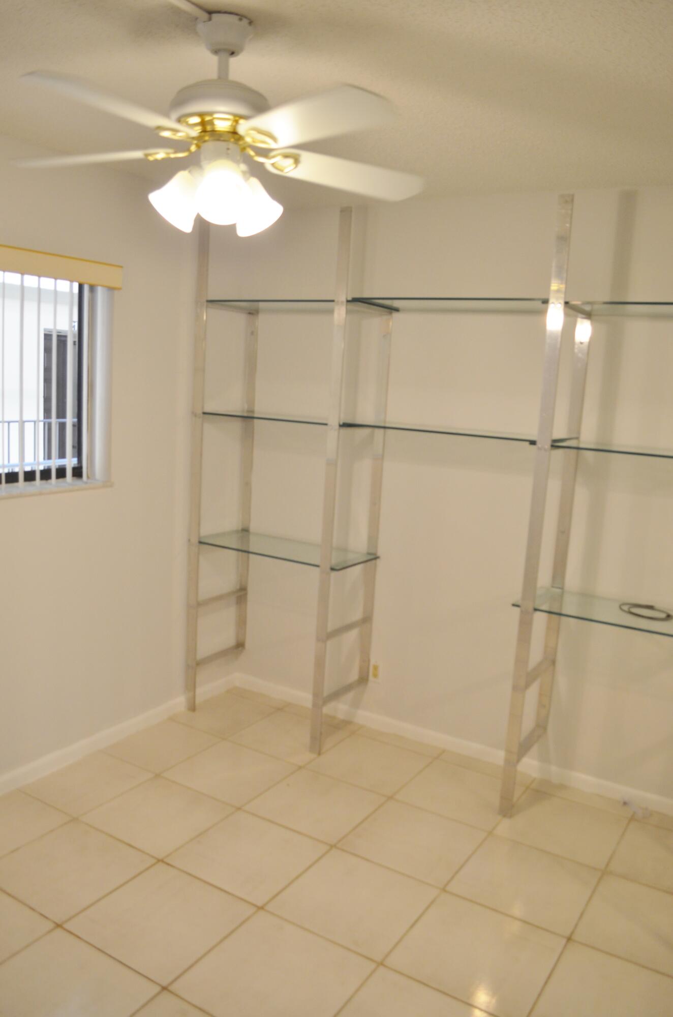 5220 Las Verdes Circle, Unit 211 Delray Beach, FL 33484 - Photo 15 of 57 a view of a small space