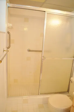 a bathroom with a tub sink and a mirror