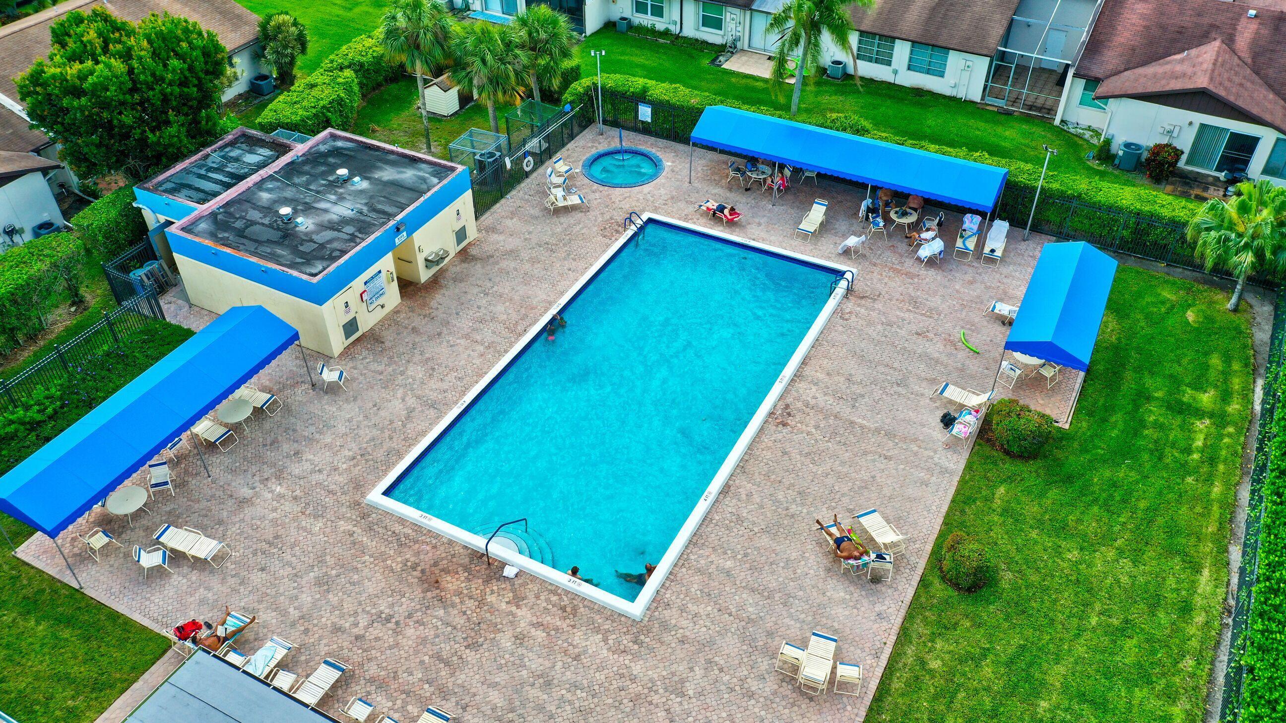 5220 Las Verdes Circle, Unit 211 Delray Beach, FL 33484 - Photo 25 of 57 an aerial view of a house with pool