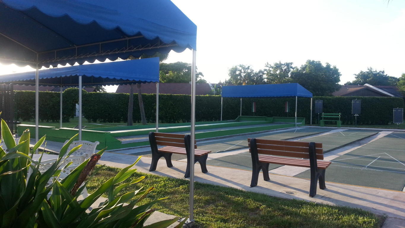 5220 Las Verdes Circle, Unit 211 Delray Beach, FL 33484 - Photo 36 of 57 a garden view with a sitting space and garden