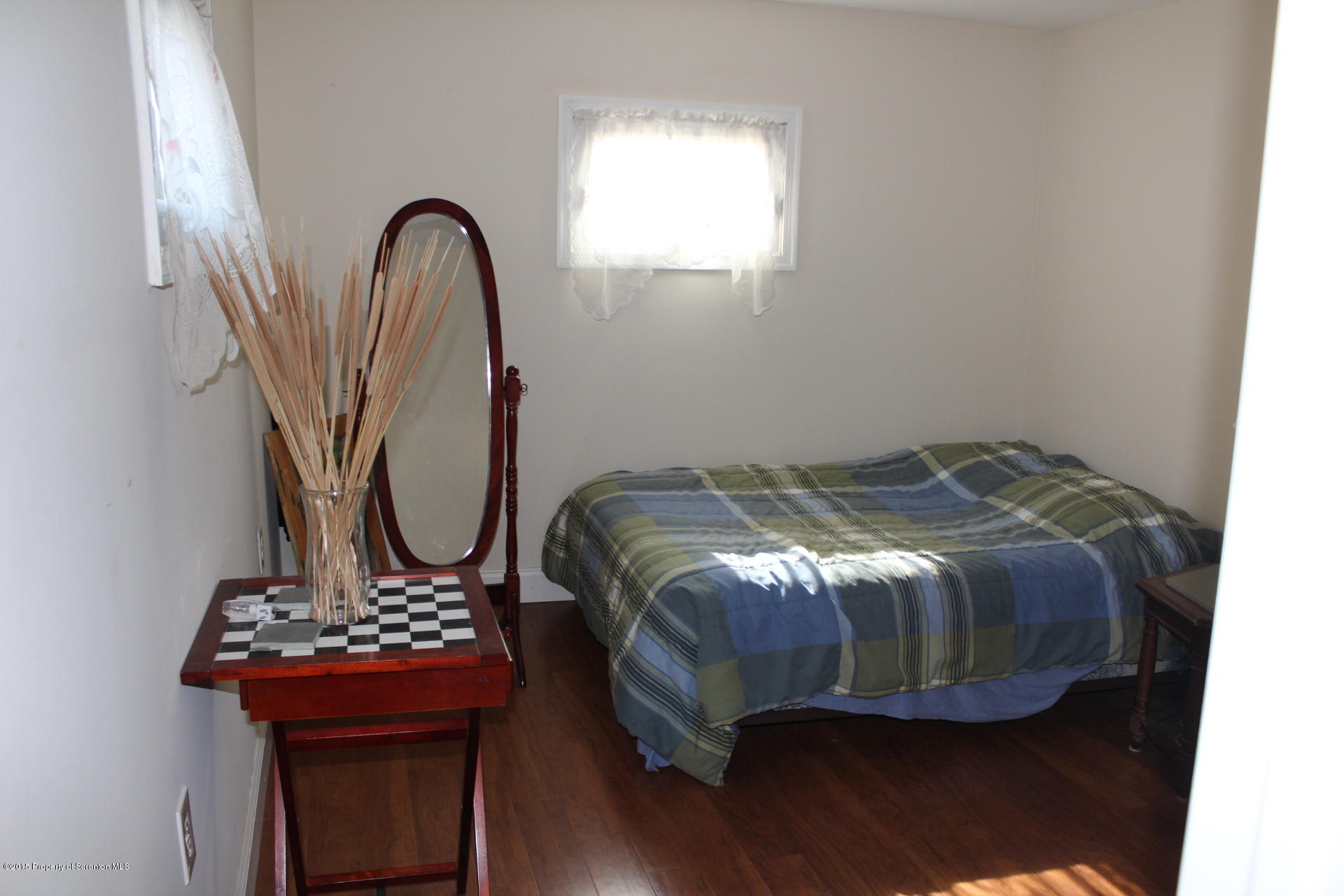 18 Linden Street Luzerne, PA 18709 - Photo 16 of 21 a bed sitting in a bedroom next to a window