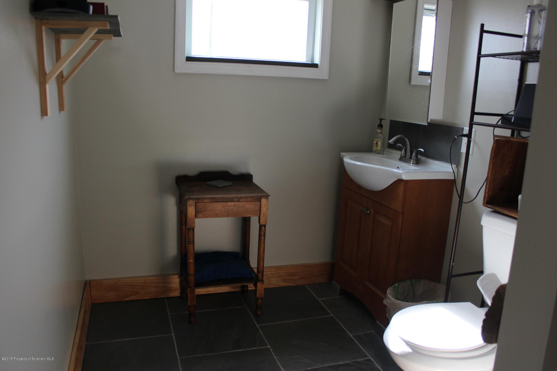 18 Linden Street Luzerne, PA 18709 - Photo 19 of 21 a bathroom with a toilet mirror vanity and a sink
