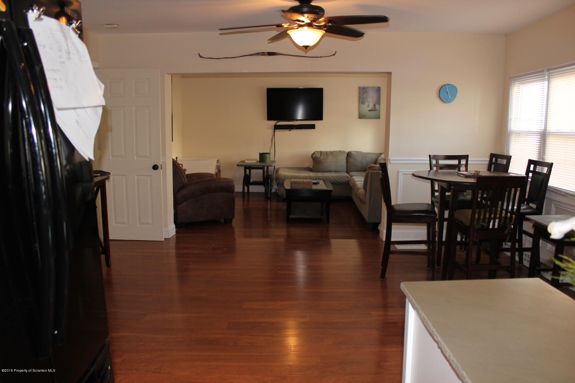 18 Linden Street Luzerne, PA 18709 - Photo 8 of 21 a living room with furniture a dining table and a large window