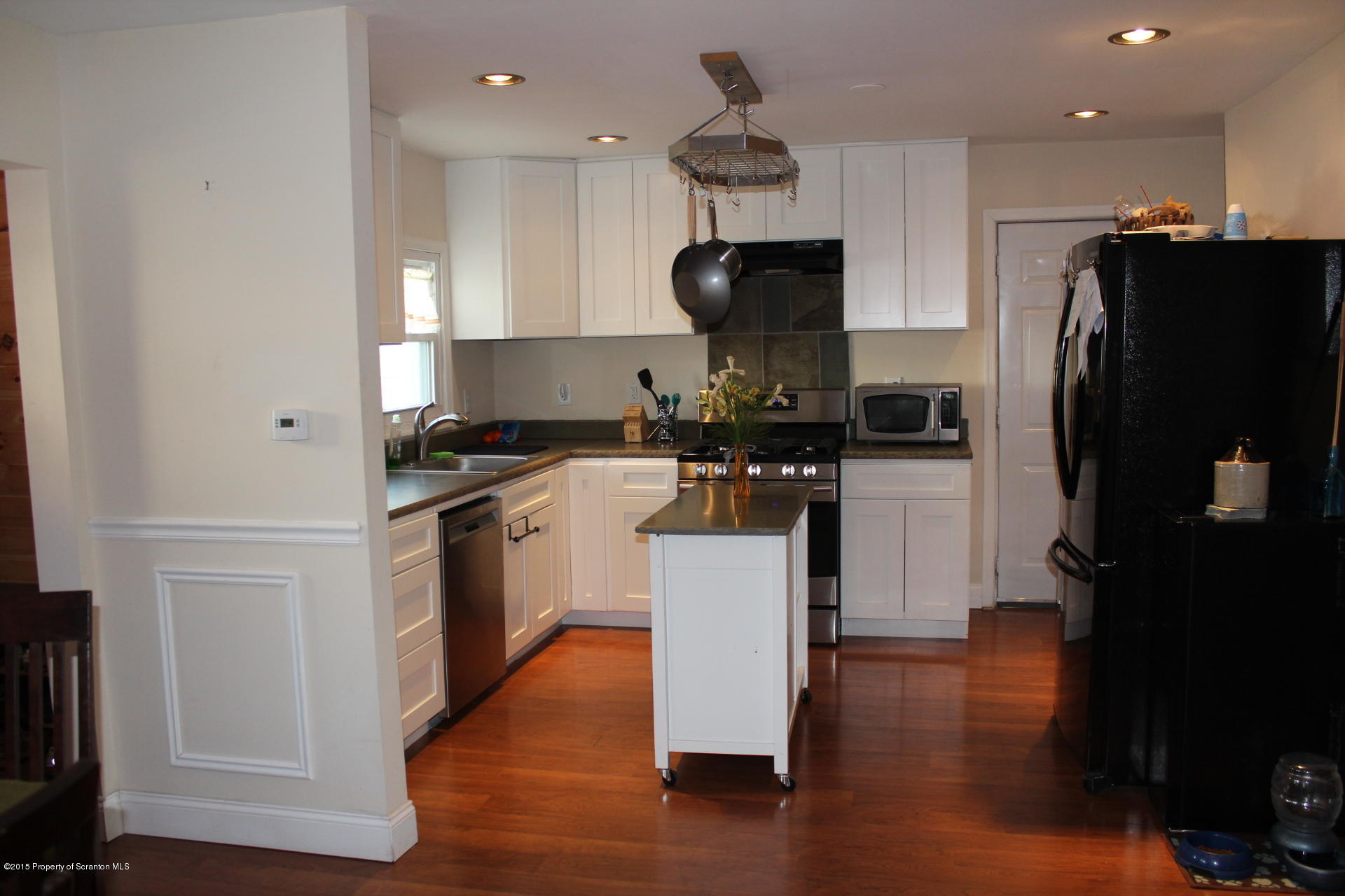18 Linden Street Luzerne, PA 18709 - Photo 9 of 21 a kitchen with a refrigerator a sink and a stove
