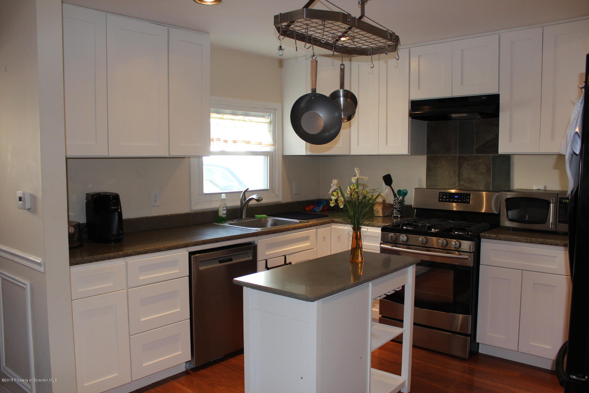 18 Linden Street Luzerne, PA 18709 - Photo 10 of 21 a kitchen with a stove and a sink