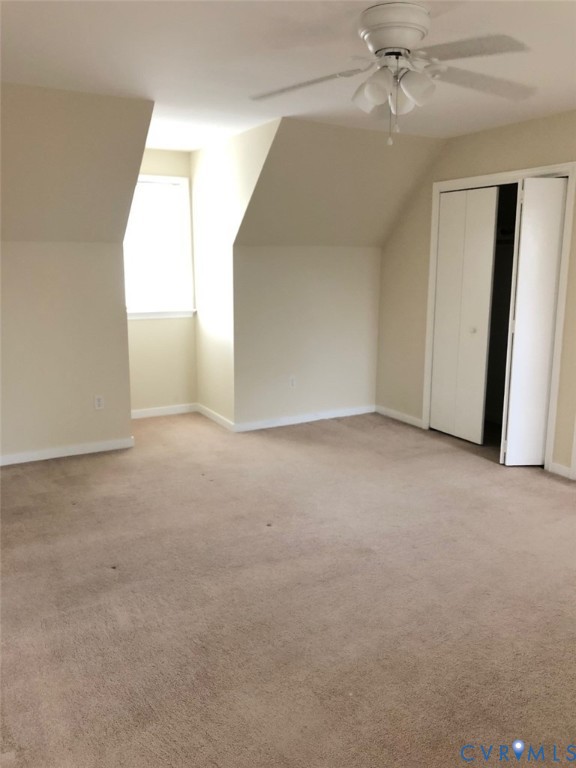 2442 Crystal Ridge Road Henrico, VA 23233 - Photo 5 of 8 an empty room with windows and fan