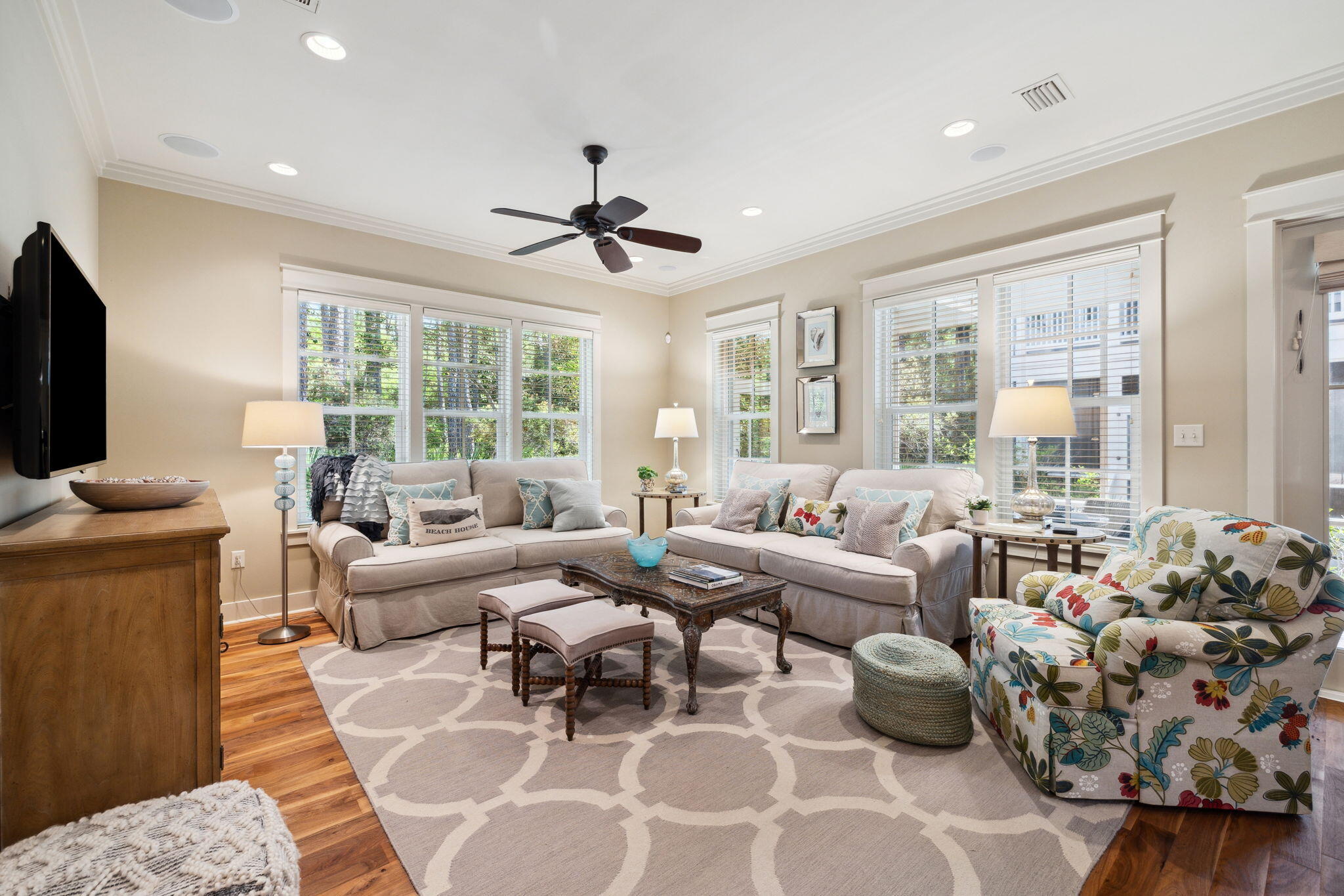 45 Plimsoll Way Santa Rosa Beach, FL 32459 - Photo 11 of 42 a living room with furniture large windows and a flat screen tv