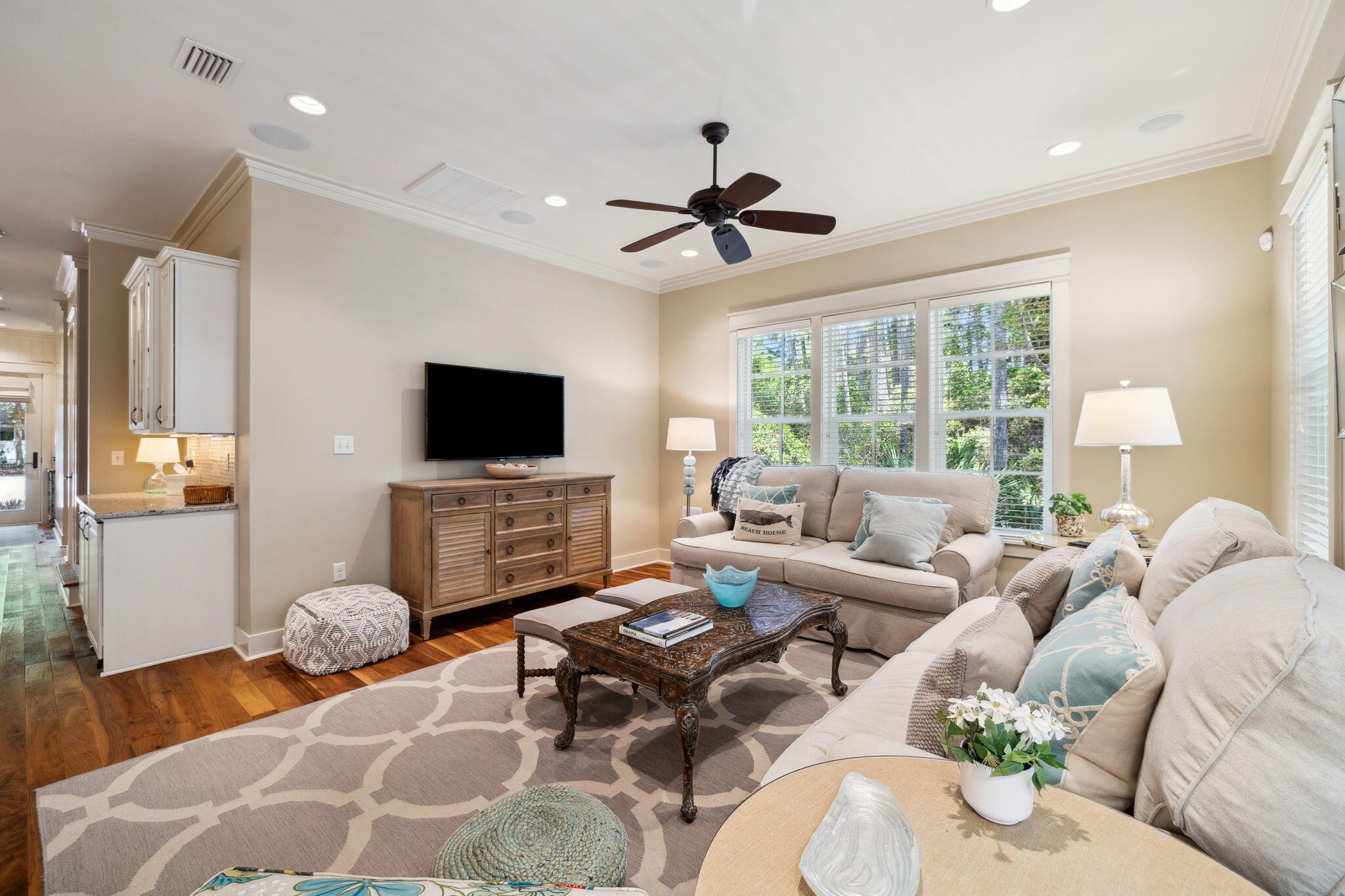 45 Plimsoll Way Santa Rosa Beach, FL 32459 - Photo 12 of 42 a living room with furniture a flat screen tv and a large window