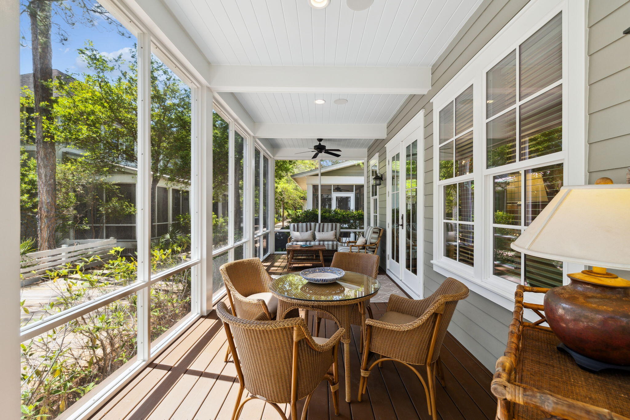 45 Plimsoll Way Santa Rosa Beach, FL 32459 - Photo 14 of 42 a dining room with wooden floor and large windows