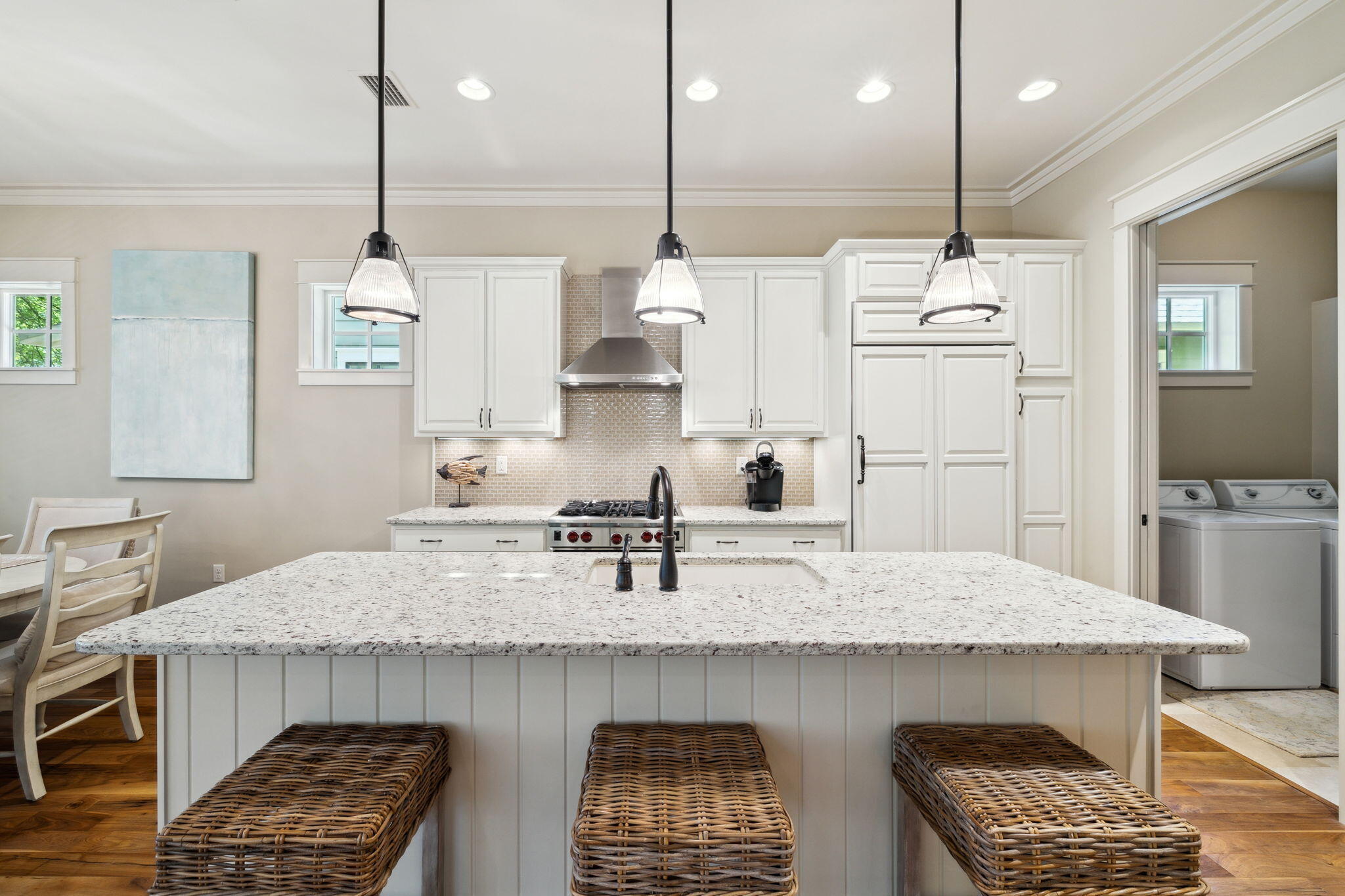 45 Plimsoll Way Santa Rosa Beach, FL 32459 - Photo 6 of 42 a kitchen with kitchen island granite countertop a sink a center island and stainless steel appliances