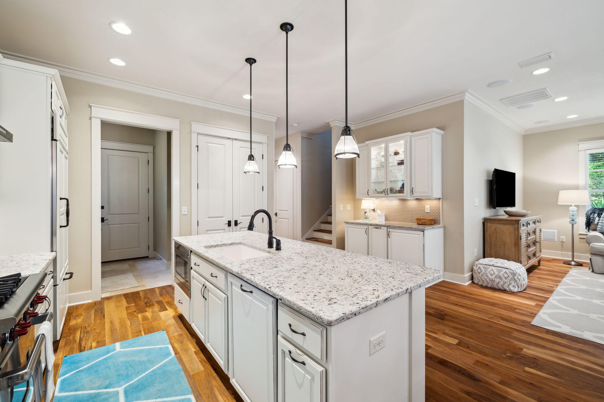 45 Plimsoll Way Santa Rosa Beach, FL 32459 - Photo 8 of 42 a large kitchen with kitchen island a large counter space a sink stainless steel appliances and cabinets