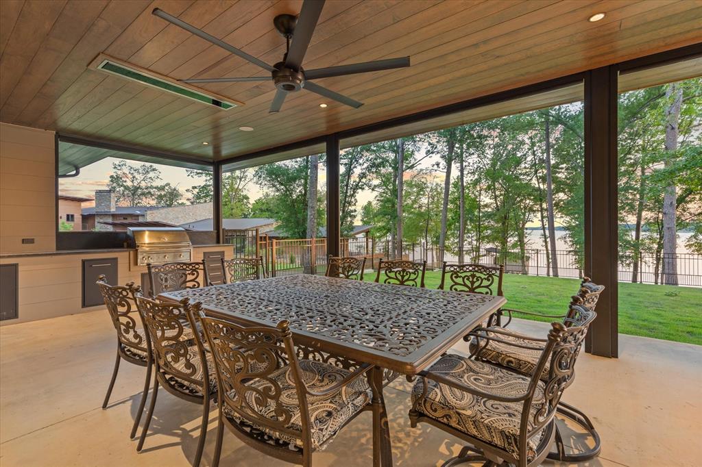 426 Lost Pittsburg, TX 75686 - Photo 35 of 40 a view of a patio with a table chairs and a backyard