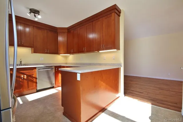 a view of a refrigerator a washer and dryer
