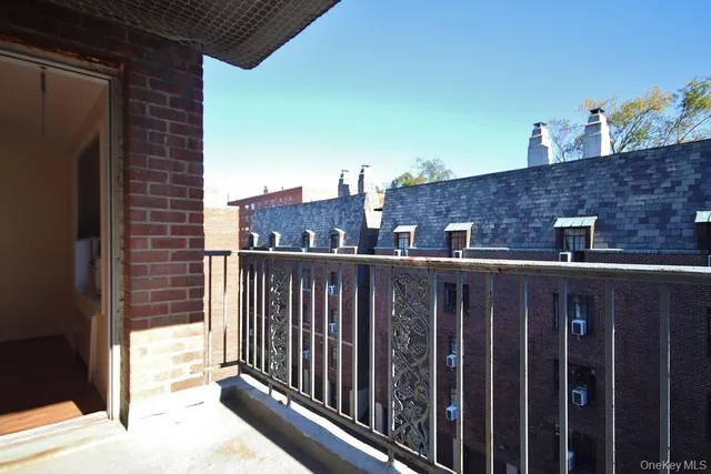 a view of balcony with furniture