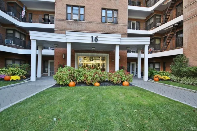 a front view of a building with an outdoor seating