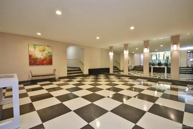 a view of a room with a checkered and black white checkered floor