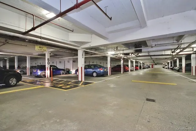 a view of a garage with cars