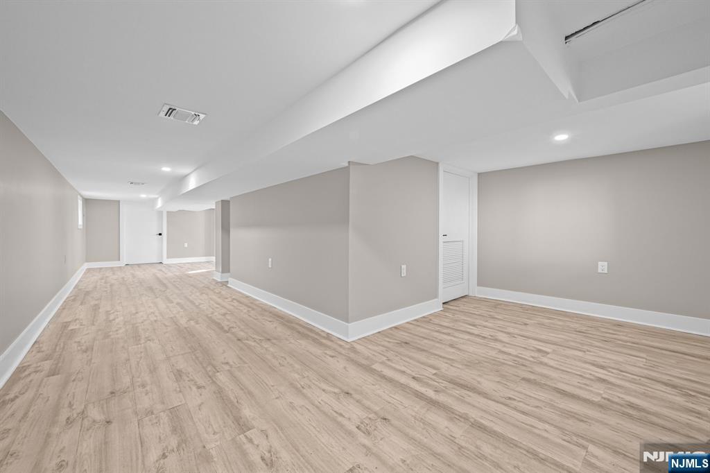 100 Kansas Street, Unit 1 Hackensack, NJ 07601 - Photo 14 of 17 a view of an empty room with wooden floor