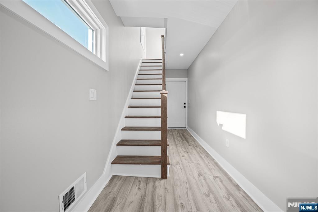 100 Kansas Street, Unit 1 Hackensack, NJ 07601 - Photo 3 of 17 a view of entryway with wooden floor