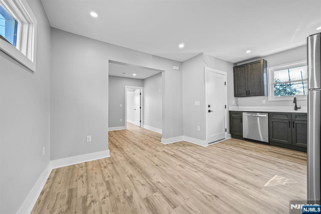 100 Kansas Street, Unit 1 Hackensack, NJ 07601 - Photo 5 of 17 a view of a kitchen with a sink and a refrigerator