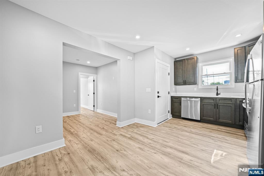 100 Kansas Street, Unit 1 Hackensack, NJ 07601 - Photo 6 of 17 a view of a kitchen with a sink and a window
