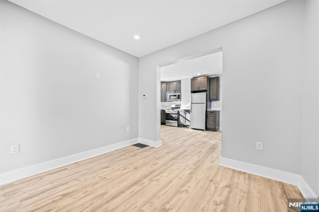 100 Kansas Street, Unit 1 Hackensack, NJ 07601 - Photo 8 of 17 a view of a room with wooden floor