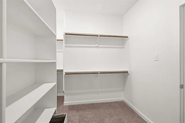 a view of an empty walk in closet