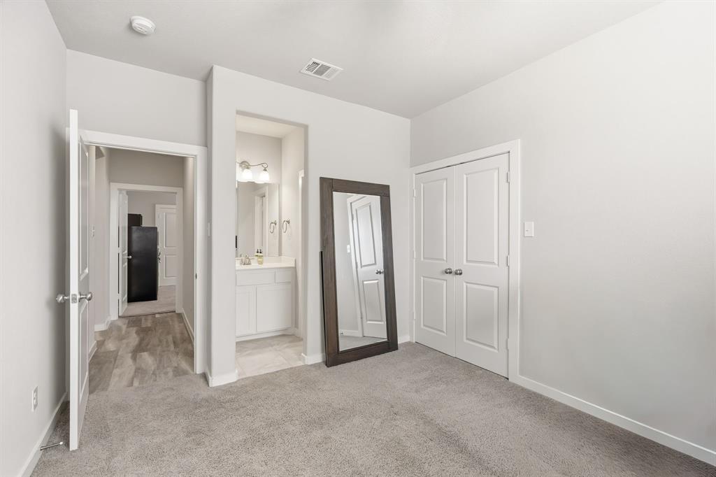 3921 Madison Lane Denton, TX 76208 - Photo 15 of 37 an empty room with closet and a bathroom