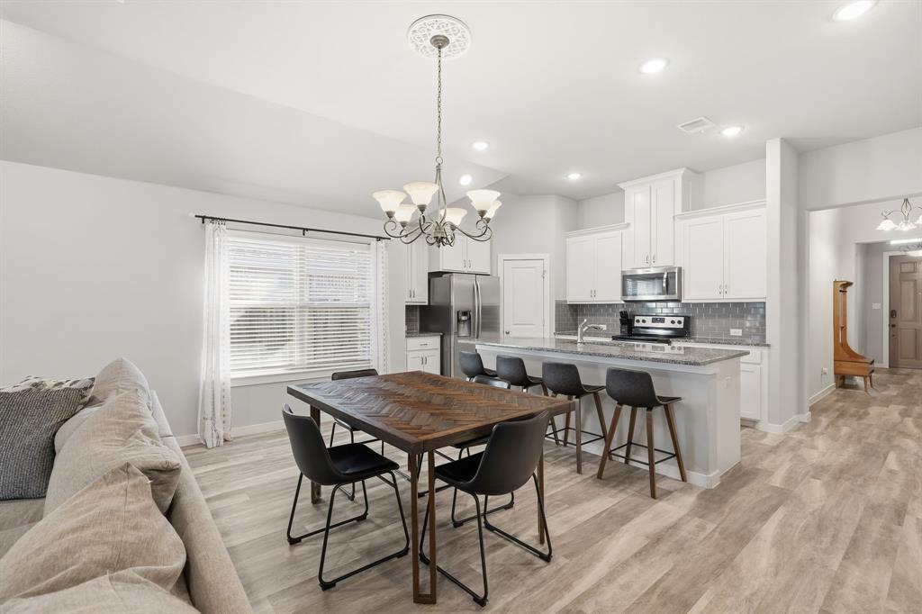 3921 Madison Lane Denton, TX 76208 - Photo 2 of 37 a view of a dining room with furniture window and wooden floor