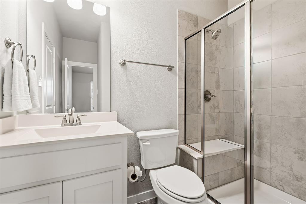 3921 Madison Lane Denton, TX 76208 - Photo 22 of 37 a bathroom with a sink a toilet and shower