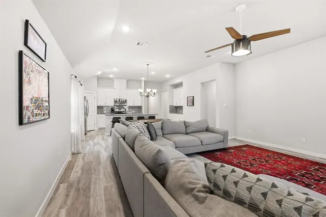 a living room with furniture and a rug