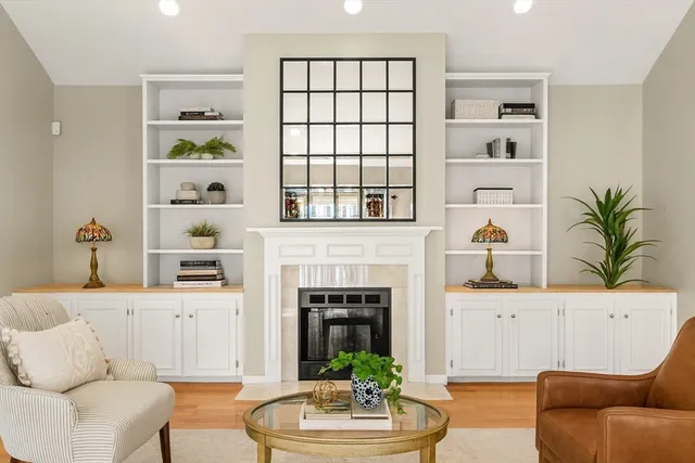 a living room with furniture and a fireplace