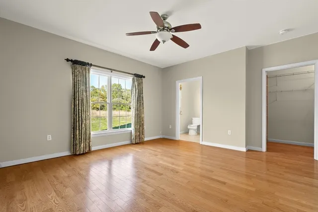 a view of room with window and ceiling fan