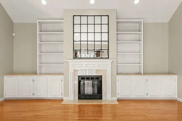 a view of a livingroom with an empty space and a fireplace