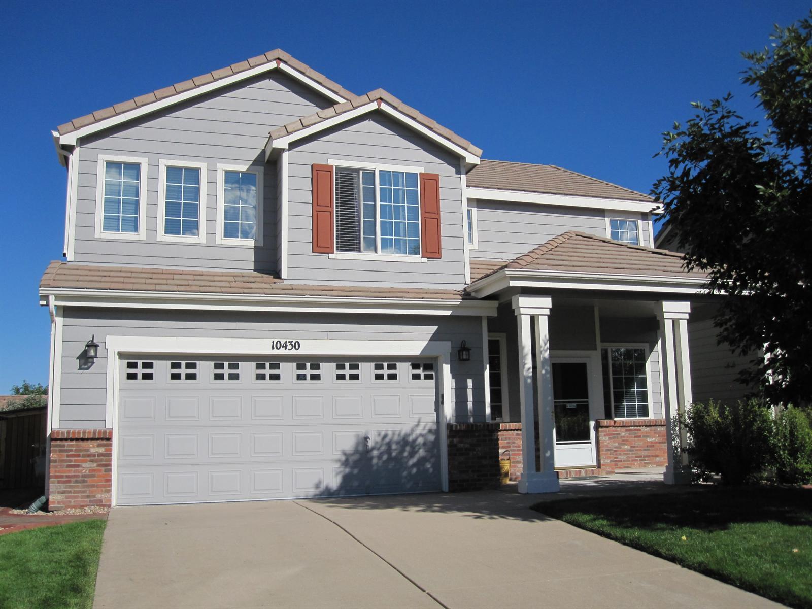 10430 Tracewood Court Highlands Ranch, CO 80130 - Photo 1 of 1 a view of a white house with a large windows