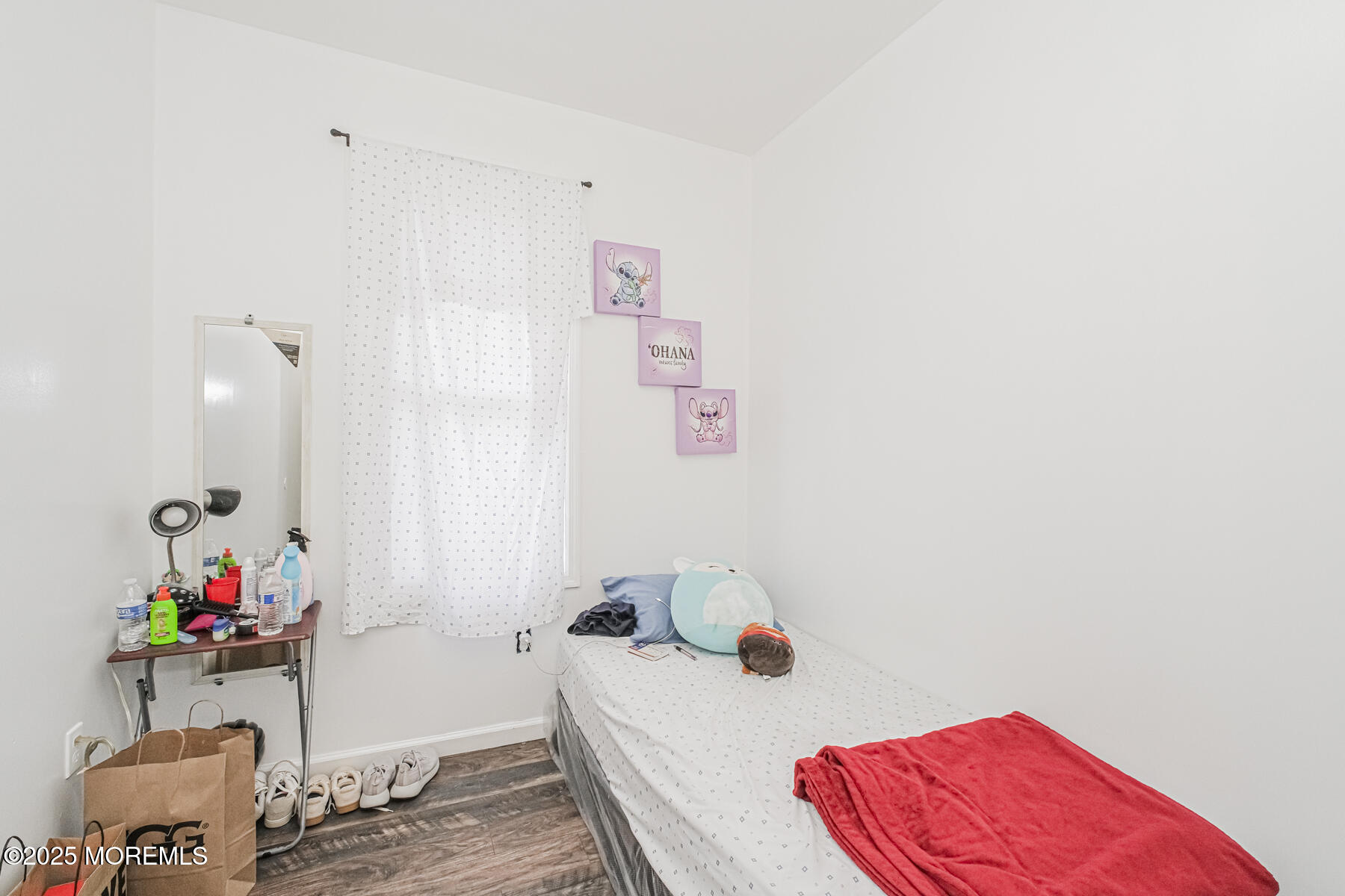 16 Alexander Street Newark, NJ 07106 - Photo 15 of 26 a bedroom with a bed and a couch