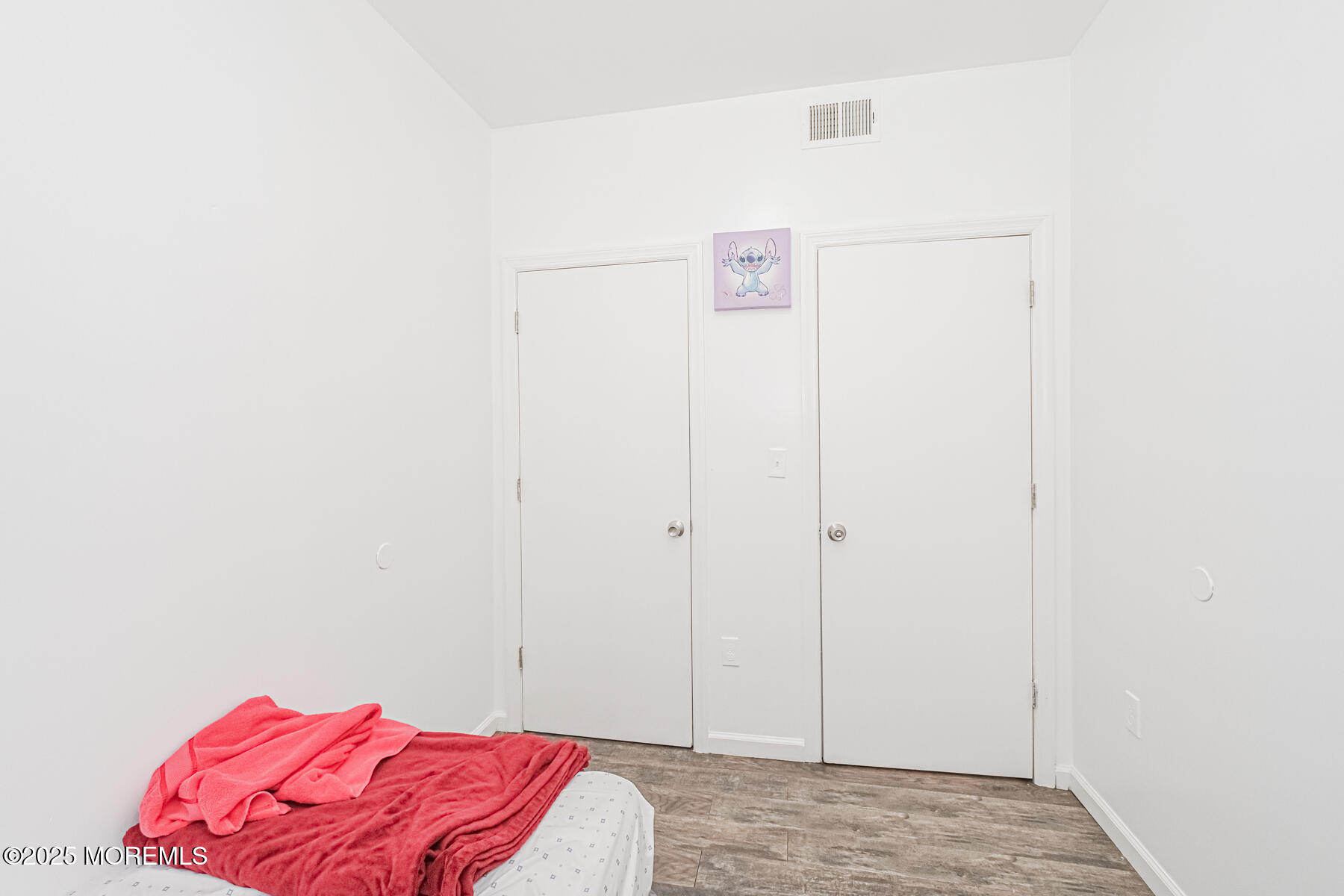 16 Alexander Street Newark, NJ 07106 - Photo 16 of 26 a view of a bedroom with a bed