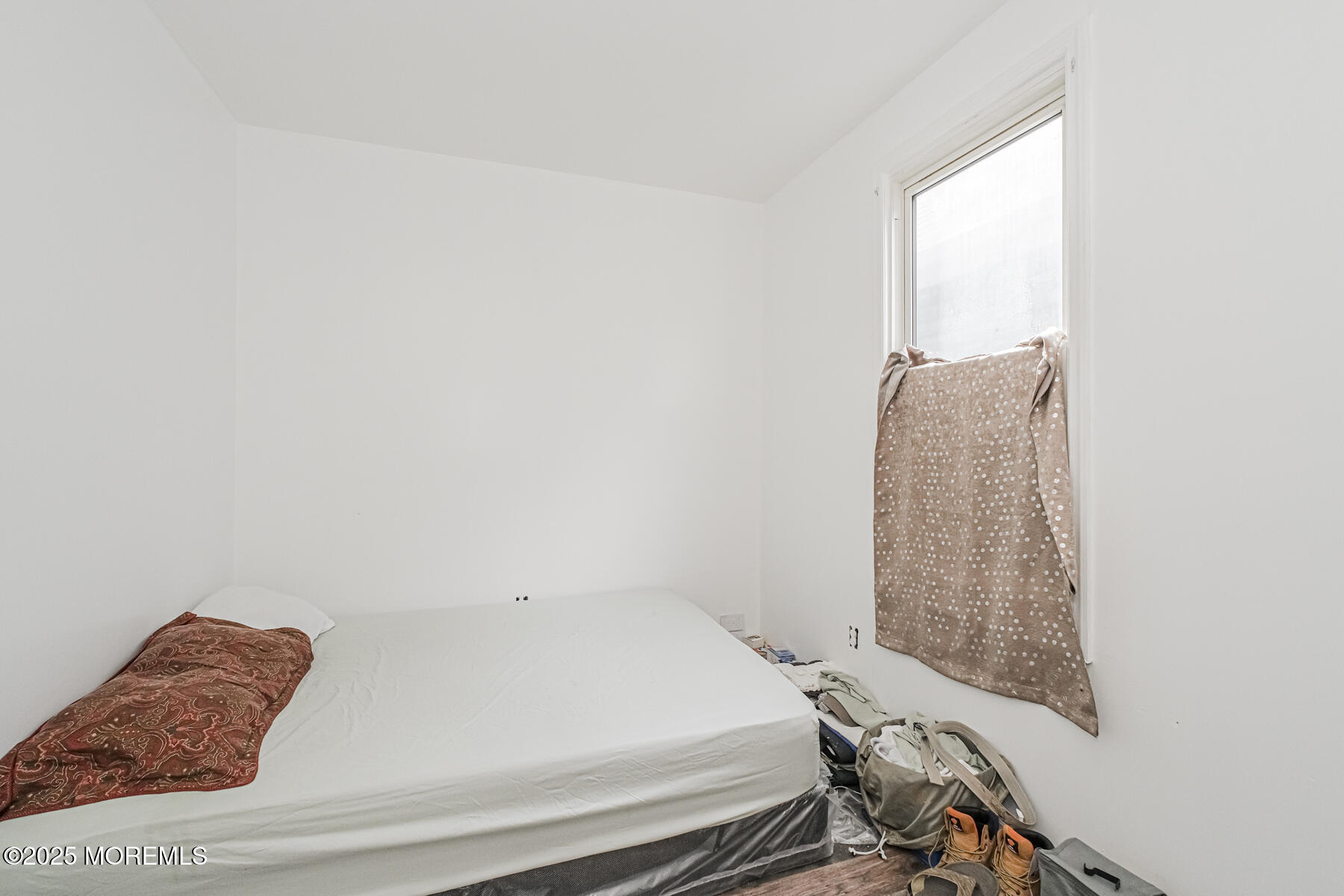 16 Alexander Street Newark, NJ 07106 - Photo 17 of 26 a bedroom with a bed and a window