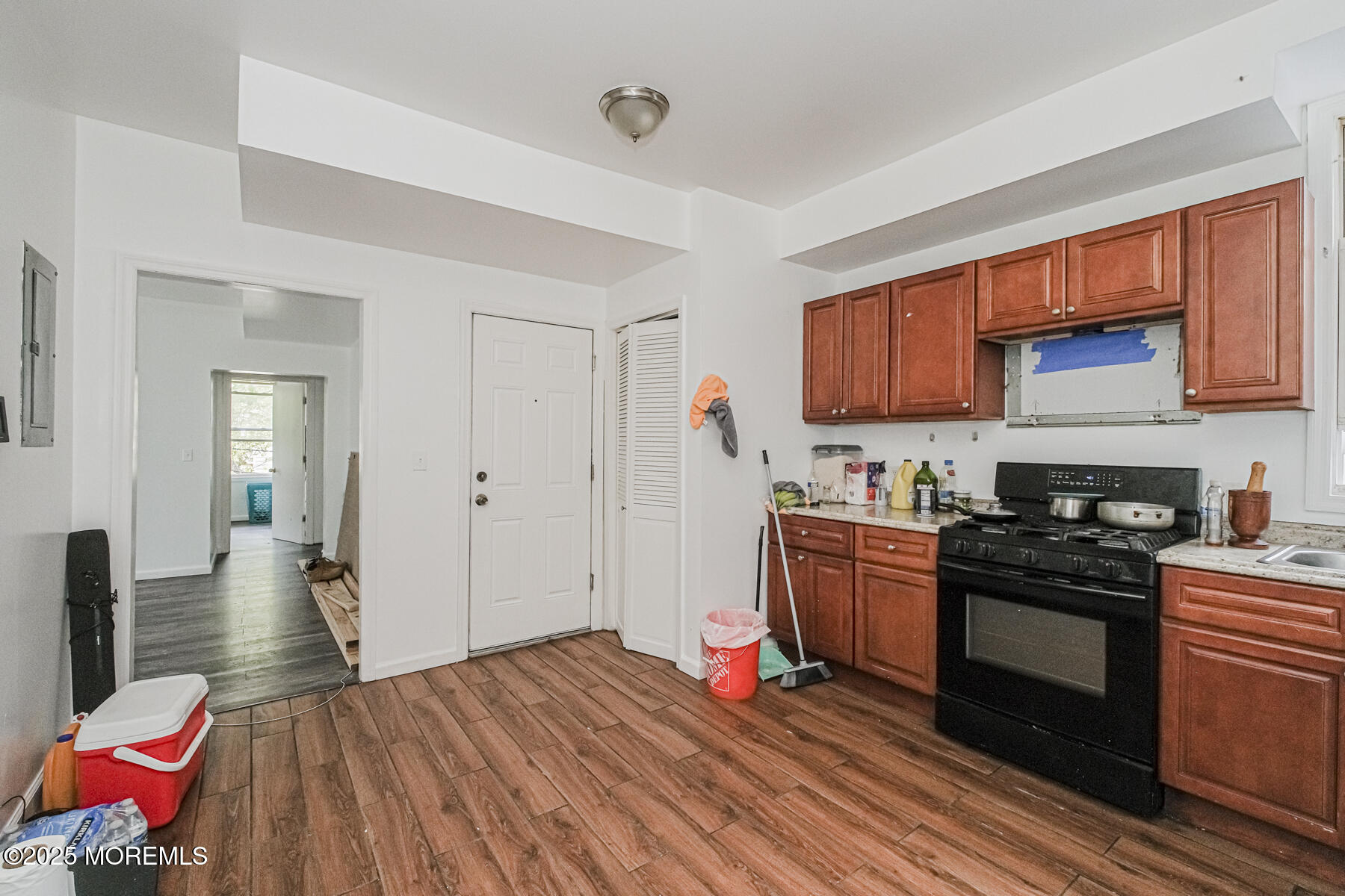 16 Alexander Street Newark, NJ 07106 - Photo 19 of 26 a kitchen with a stove a sink and a refrigerator