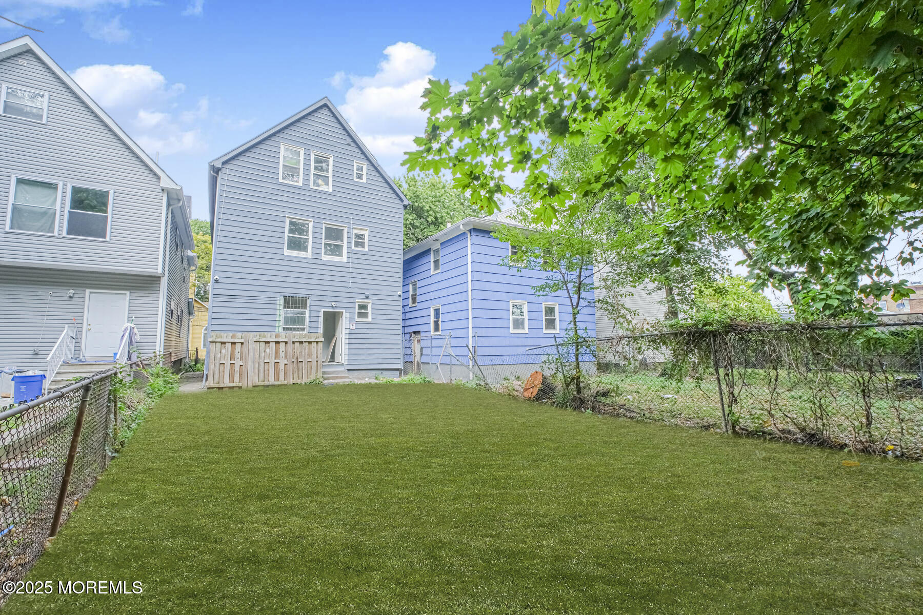 16 Alexander Street Newark, NJ 07106 - Photo 26 of 26 a view of a house with a yard and a garden