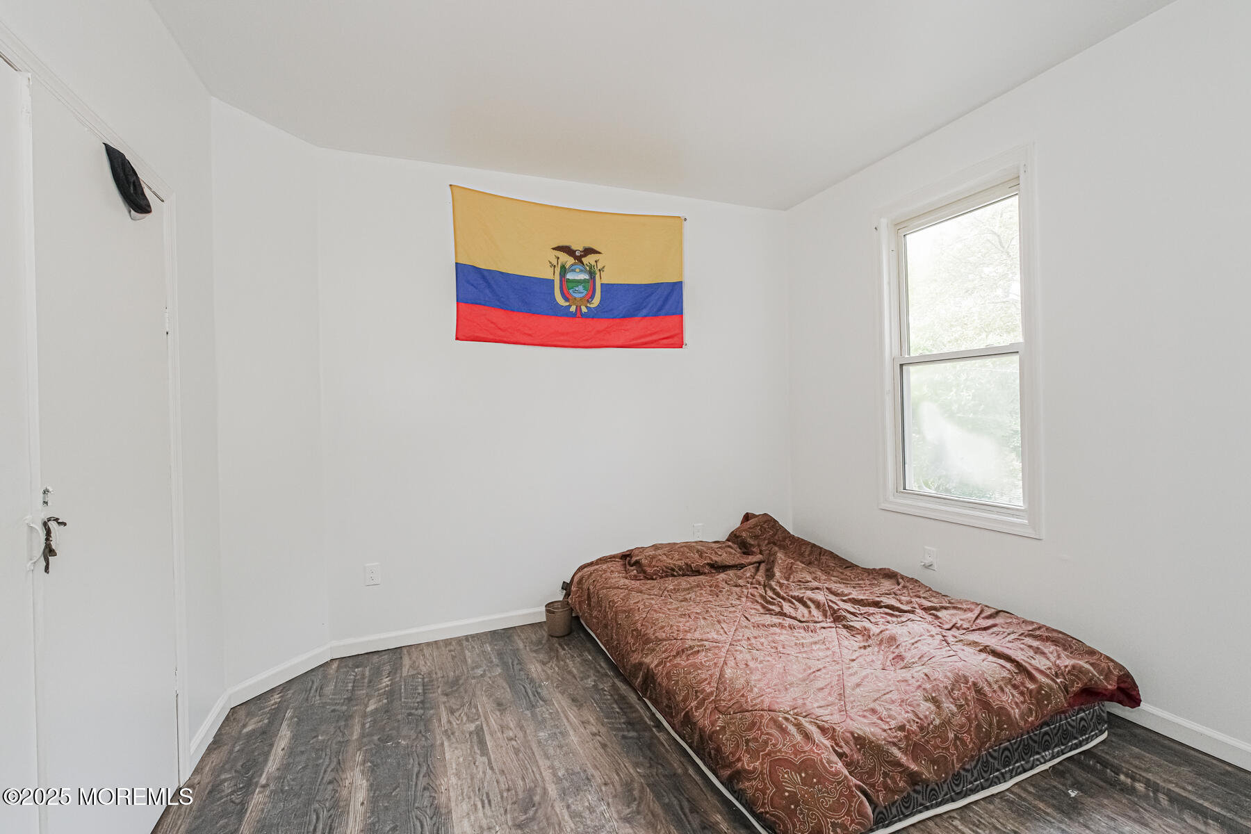 16 Alexander Street Newark, NJ 07106 - Photo 6 of 26 a bedroom with bed and a window