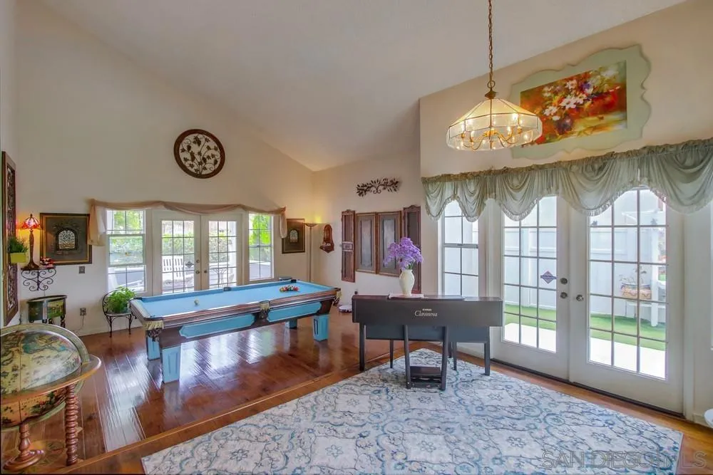 13590 Freeport Road San Diego, CA 92129 - Photo 12 of 58 a view of a dining room with furniture window and wooden floor